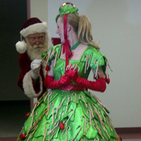 Candy Cane Dress       Children’s eyes will light up as they see this character enter the room. They are invited to take a treat from this dress, in the shape of a Christmas tree, covered in candy canes! A great addition to Santa or for the Christmas parade! 